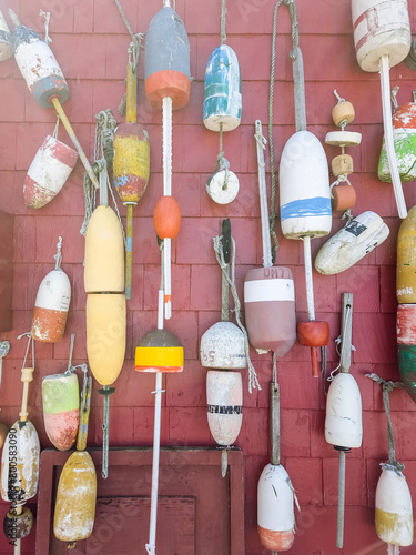 Boating and fishing floats and oars on a sun washed background