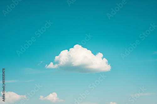 A single bright cloud in a clear sky, symbolizing the optimism and vision required in leadership 