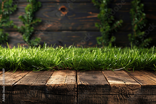 Fresh Green Grass on Dark Wooden Boards Background © VanDesigns