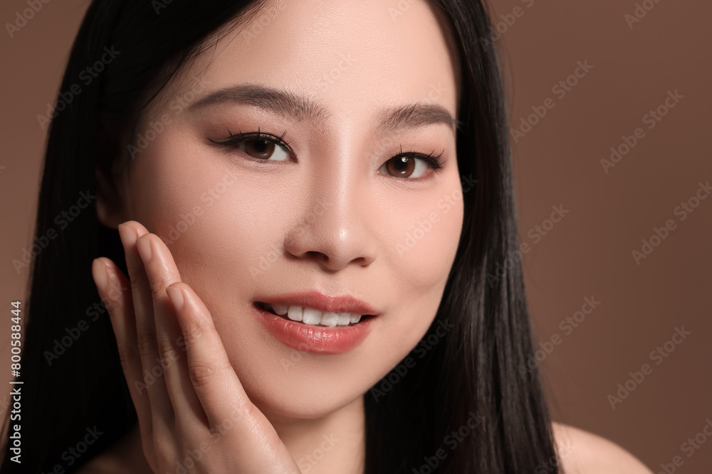 Portrait of beautiful woman on brown background, closeup Portrait of beautiful woman on brown background, closeup
