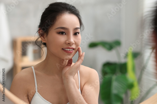 Free Download Portrait of beautiful woman near mirror indoors - GFXLoad