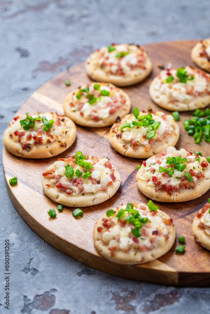 Small French dish tarte flambee cream cheese, bacon and onions Small French dish tarte flambee cream cheese, bacon and onions