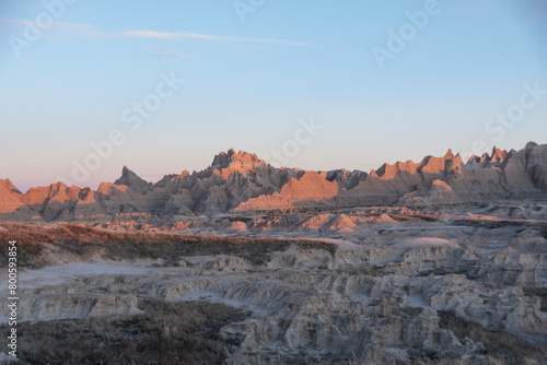 Geological Rock Formations hightlighted by the sun in the early morning hours in South Dakota's Badlands National Park in Spring