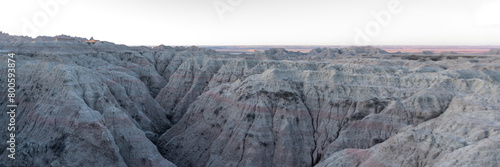 Panoramic Geological Rock Formations hightlighted by the sun in the early morning hours in South Dakota's Badlands National Park in Spring