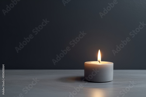 Tranquil candlelight on dark background with flickering flame