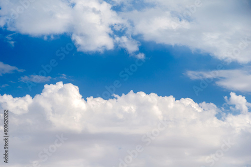 Blue sky with cumulus cloud formations, natural background