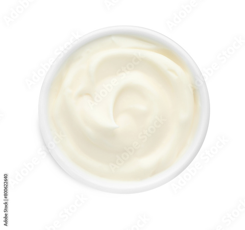 Tasty fresh mayonnaise sauce in bowl isolated on white, top view