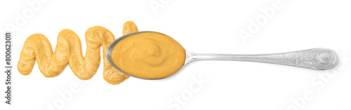 Tasty mustard sauce and spoon isolated on white, top view photo