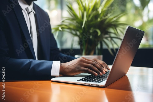 business man working on a laptop typing