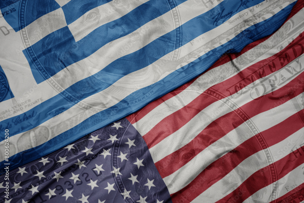 Obraz premium waving colorful flag of united states of america and national flag of greece on the dollar money background. finance concept. macro