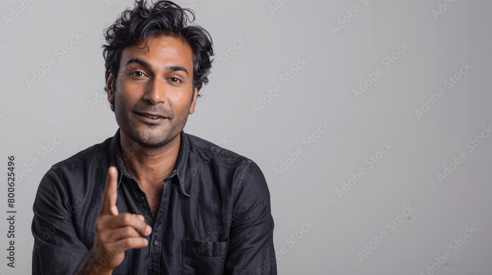 Fototapeta premium man holding up his hand, pointing to something