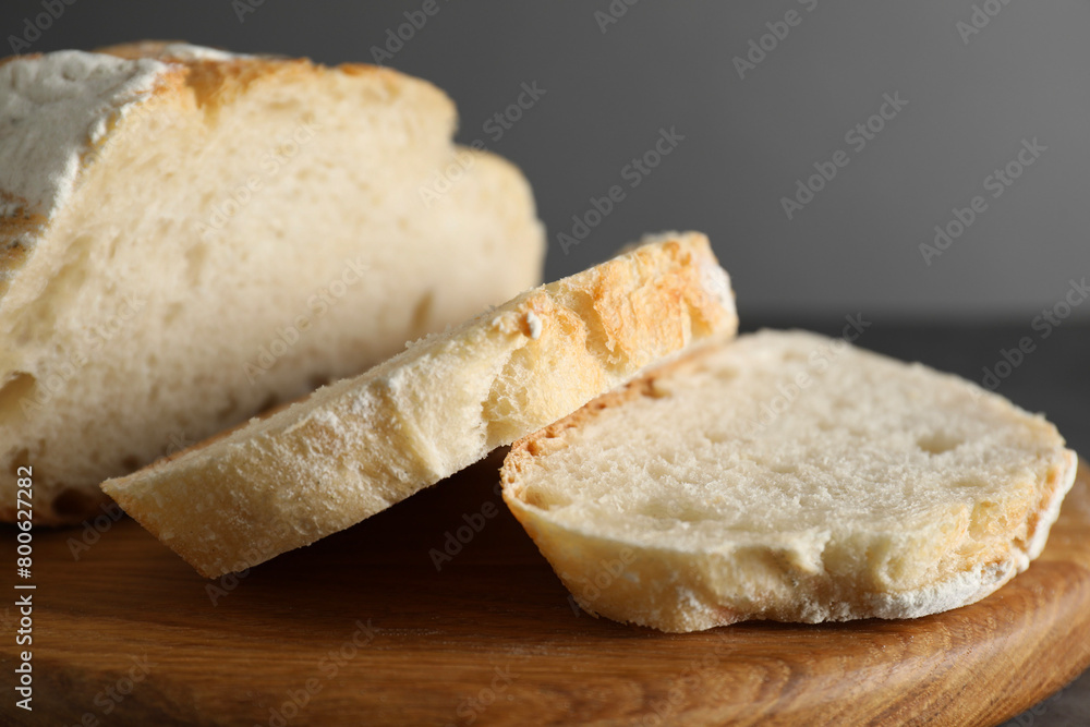 Freshly baked cut sourdough bread on grey table, closeup Freshly baked cut sourdough bread on grey table, closeup