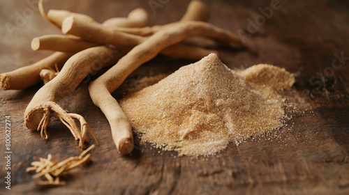 Dried aswagandha powder and whole root on a table. Herbal medicine. photo