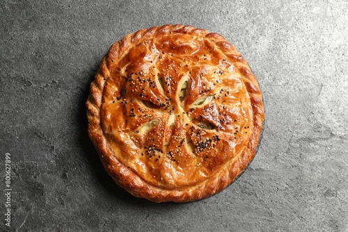 Принти на полотні Tasty homemade pie with filling on grey table, top view