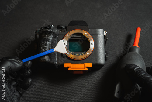 Professional sensor cleaning on a mirrorless camera, close-up photo. photo