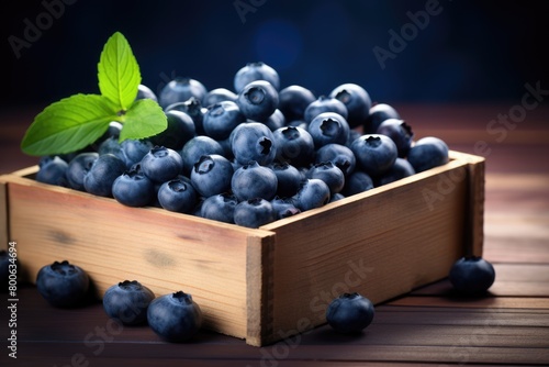 A wooden box full of fresh blueberries