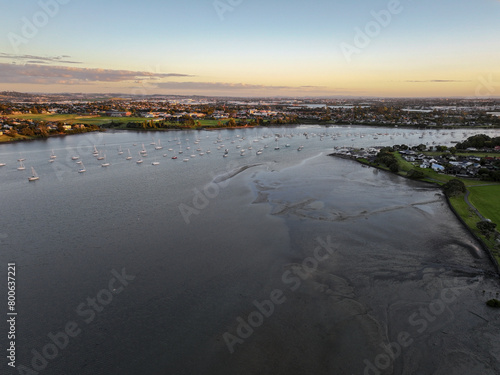 Panoramic view of boats on the Tamaki river at sunset in Auckland, NZ