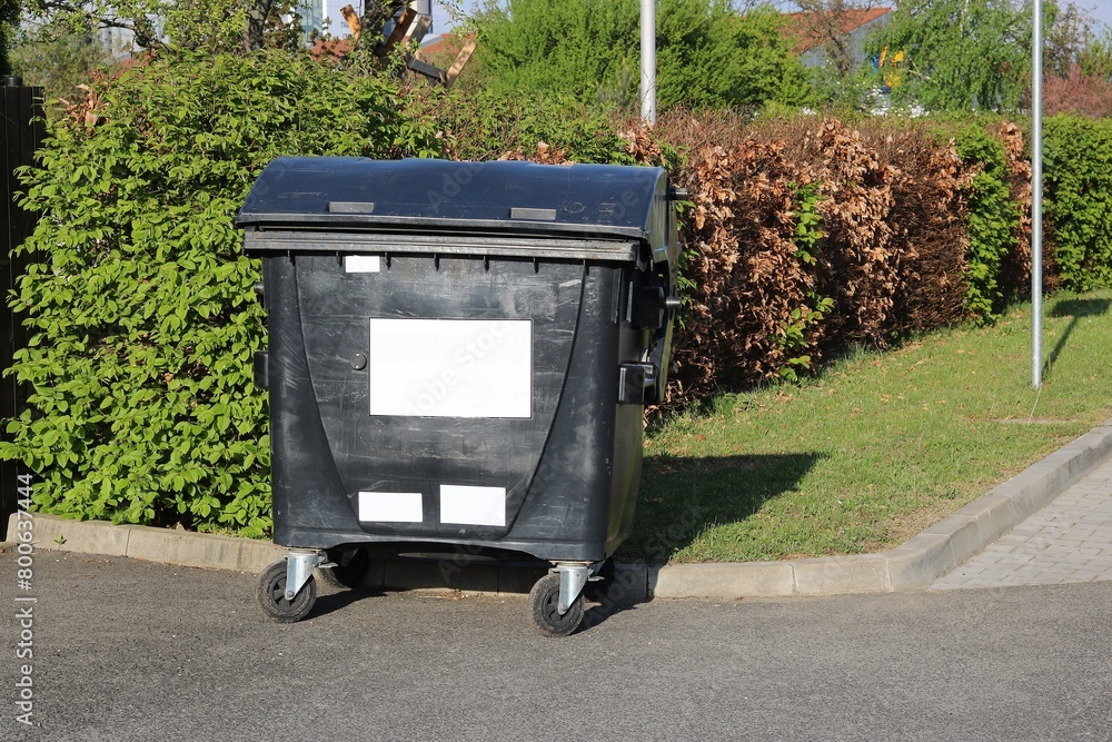 Mixed waste container on the side of the street in the city Mixed waste container on the side of the street in the city