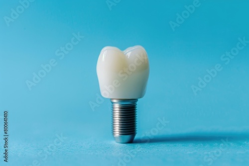 Close-up of a tooth on a blue background. Ideal for dental concepts