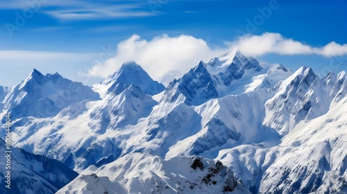 Panoramic view of the snow-capped peaks of the Alps