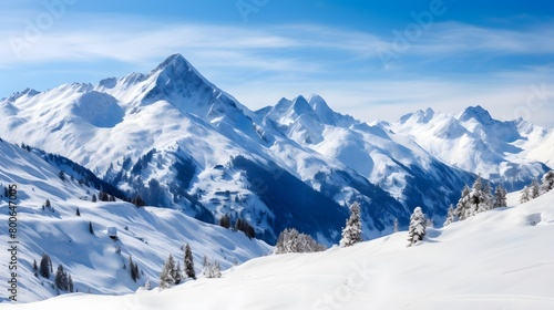 Winter mountains panorama with snow-capped peaks and blue sky