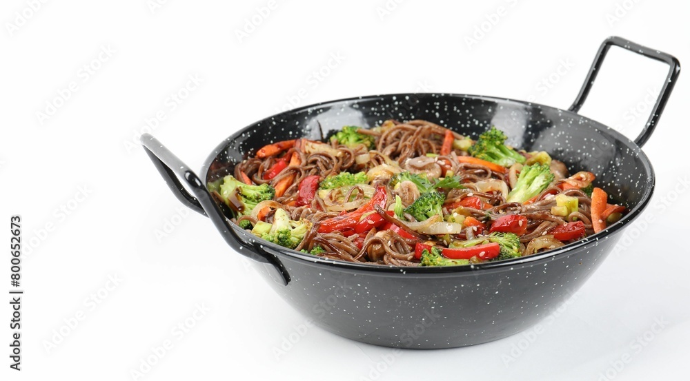 Stir-fry. Tasty noodles with meat and vegetables in wok on white background Stir-fry. Tasty noodles with meat and vegetables in wok on white background