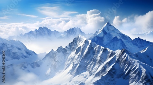 Panoramic view of the snow-capped mountains in the clouds