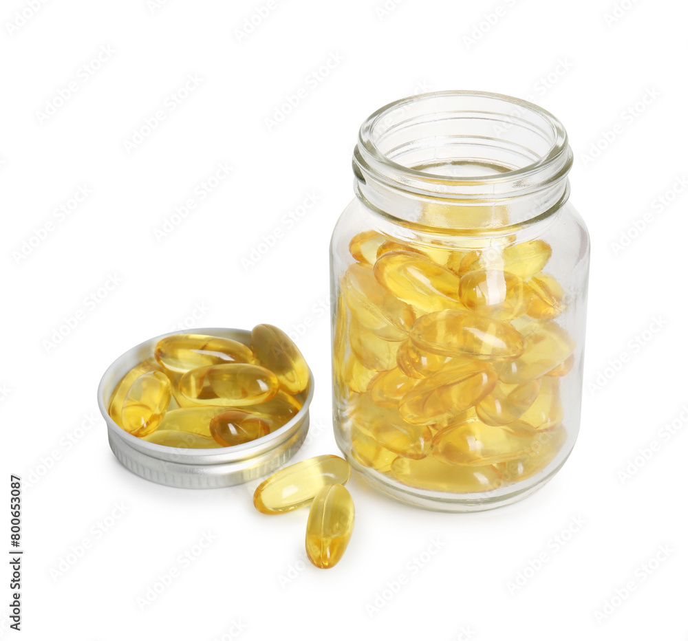 Bottle and pile of softgel capsules isolated on white Bottle and pile of softgel capsules isolated on white