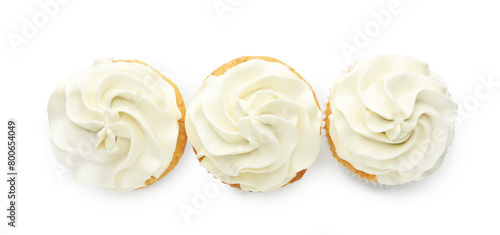 Tasty vanilla cupcakes with cream isolated on white, top view