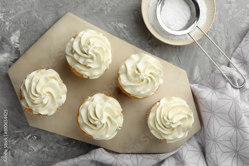 Wallpaper Mural Tasty cupcakes with vanilla cream on grey table, top view Torontodigital.ca