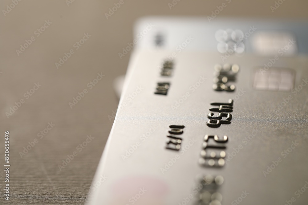 Credit card on beige background, closeup. Space for text Credit card on beige background, closeup. Space for text