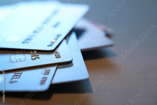 Many credit cards on gray background, closeup