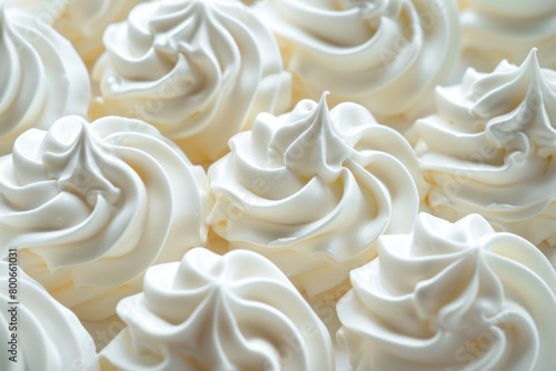 A close-up shot of a plate of cupcakes with white frosting. Perfect for bakery or dessert-themed designs