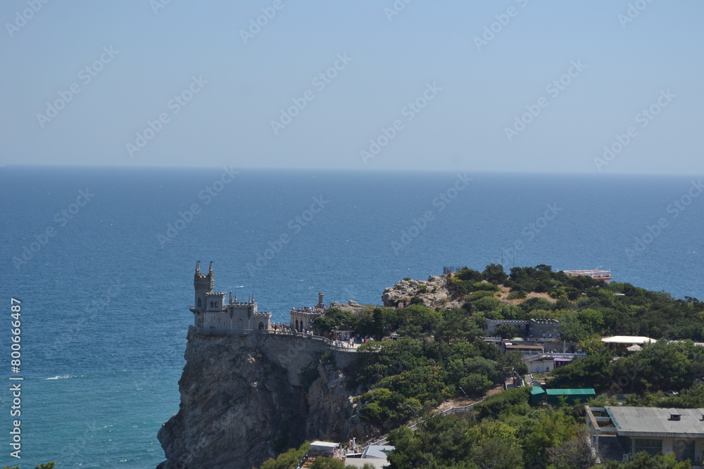 castle on the coast of the sea in the mountains