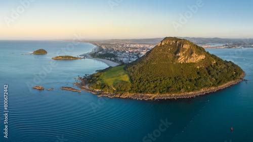 Aerial: Mount Maunganui, the township, beach and the harbour into Tauranga, Bay Of Plenty, New Zealand photo