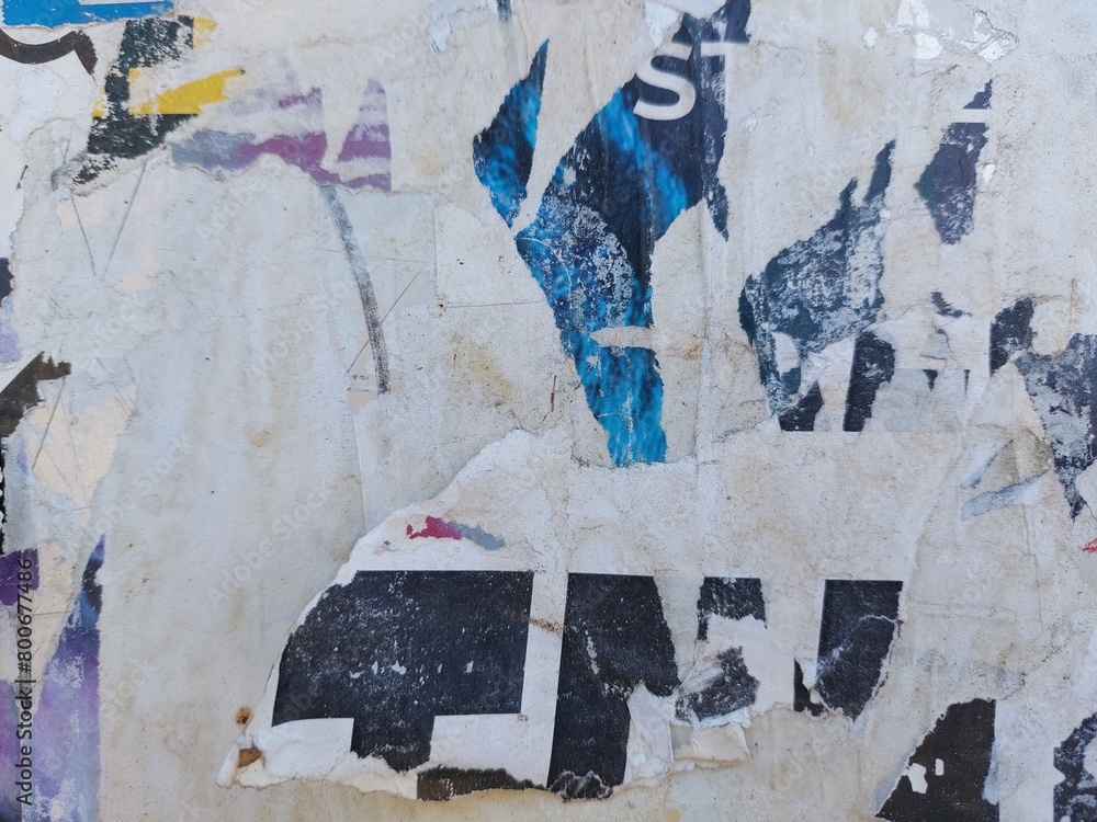 Fototapeta premium Torn and ripped street poster background, abstract and messy old paper art collage