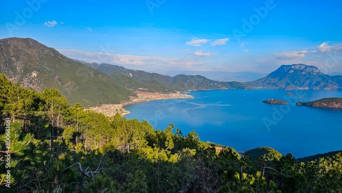 Valley with a Lugu Lake and distant mountains in China photo