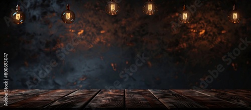 Dark wooden table with dark background and hanging lamps photo