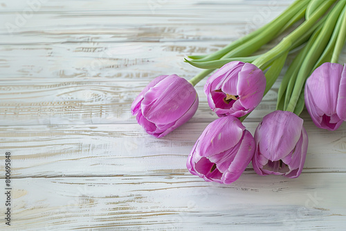Beautiful Purple Tulips on a Light Wooden Board with Space for Copy, Mothers Day photo