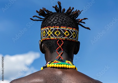 an african man wearing a traditional beaded headband with a zulu pattern photo