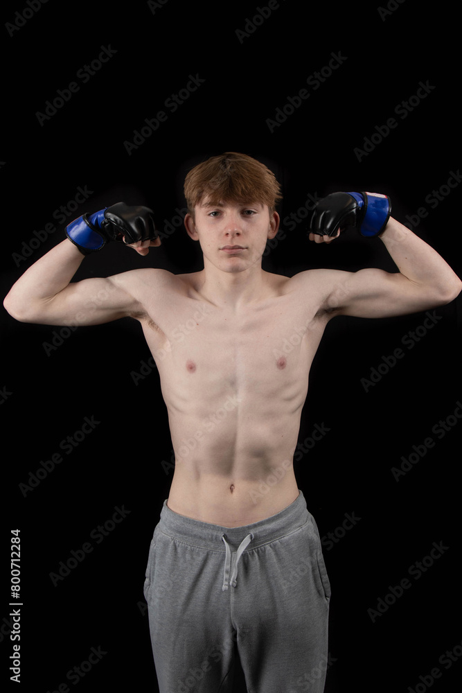 Naklejka premium A Shirtless Teenager Boxer