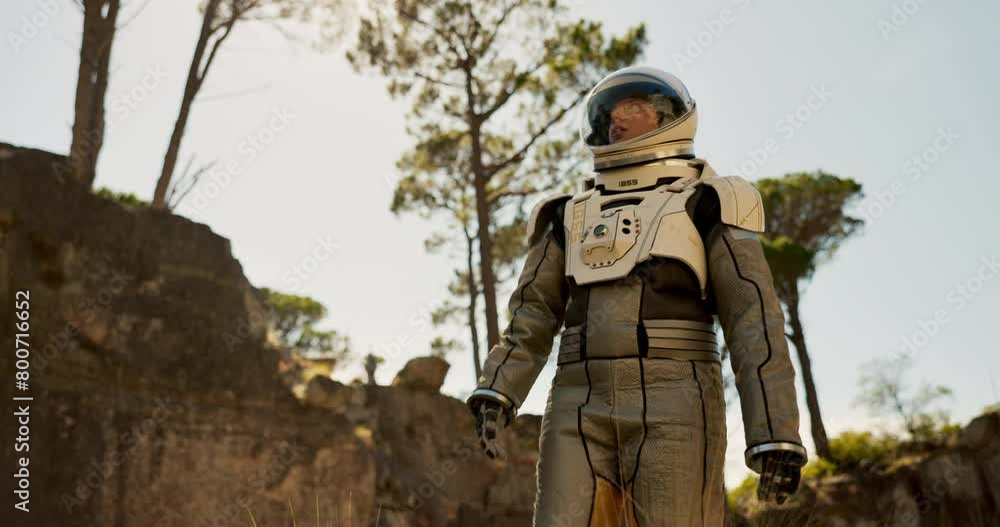 Planet, travel and astronaut walking in forest to explore abandoned world, planet and universe. Space suit, futuristic fantasy and spaceman in alien environment for exploration, adventure and journey Planet, travel and astronaut walking in forest to explore abandoned world, planet and universe. Space suit, futuristic fantasy and spaceman in alien environment for exploration, adventure and journey