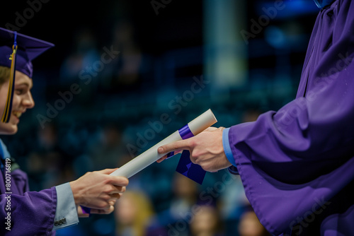 Delivery of university diploma at the end of the degree, representing the successful completion of rigorous coursework and the beginning of professional endeavors photo