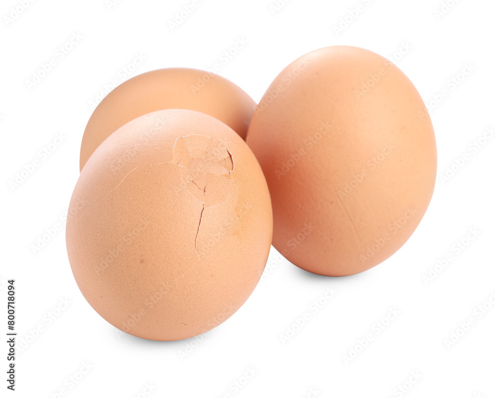 Whole and cracked chicken eggs isolated on white Whole and cracked chicken eggs isolated on white