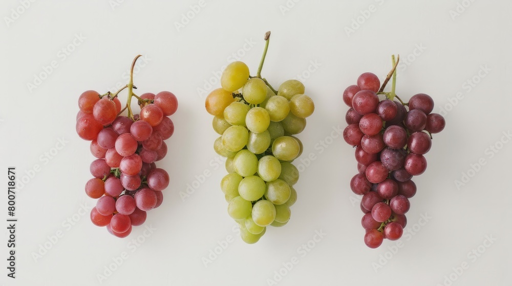 Fototapeta premium A minimalist composition of red and green grapes on a white background generative ai