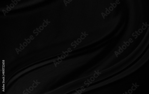 Black gray satin dark fabric texture luxurious shiny that is abstract silk cloth background with patterns soft waves blur beautiful.