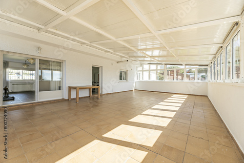 A closed terrace with metal roofs and the entire perimeter with glass windows