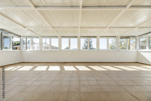 Wallpaper Mural A large closed terrace with metal roofs, light brown floors and the entire perimeter with glass and aluminum windows with good views Torontodigital.ca