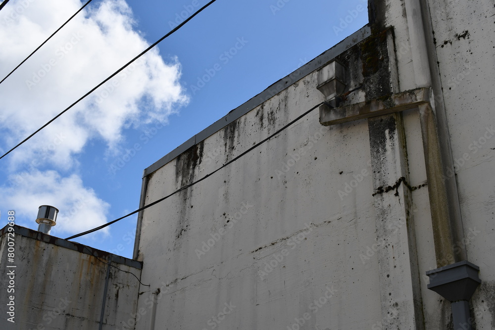 Back alley buildings, black stains from weathering. Back alley buildings, black stains from weathering.