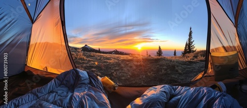 View of the sunrise on the mountain in the morning from inside the tent #800731403